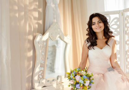 A beautiful young bride in a dress holding a bouquet AI-generated content may be incorrect.